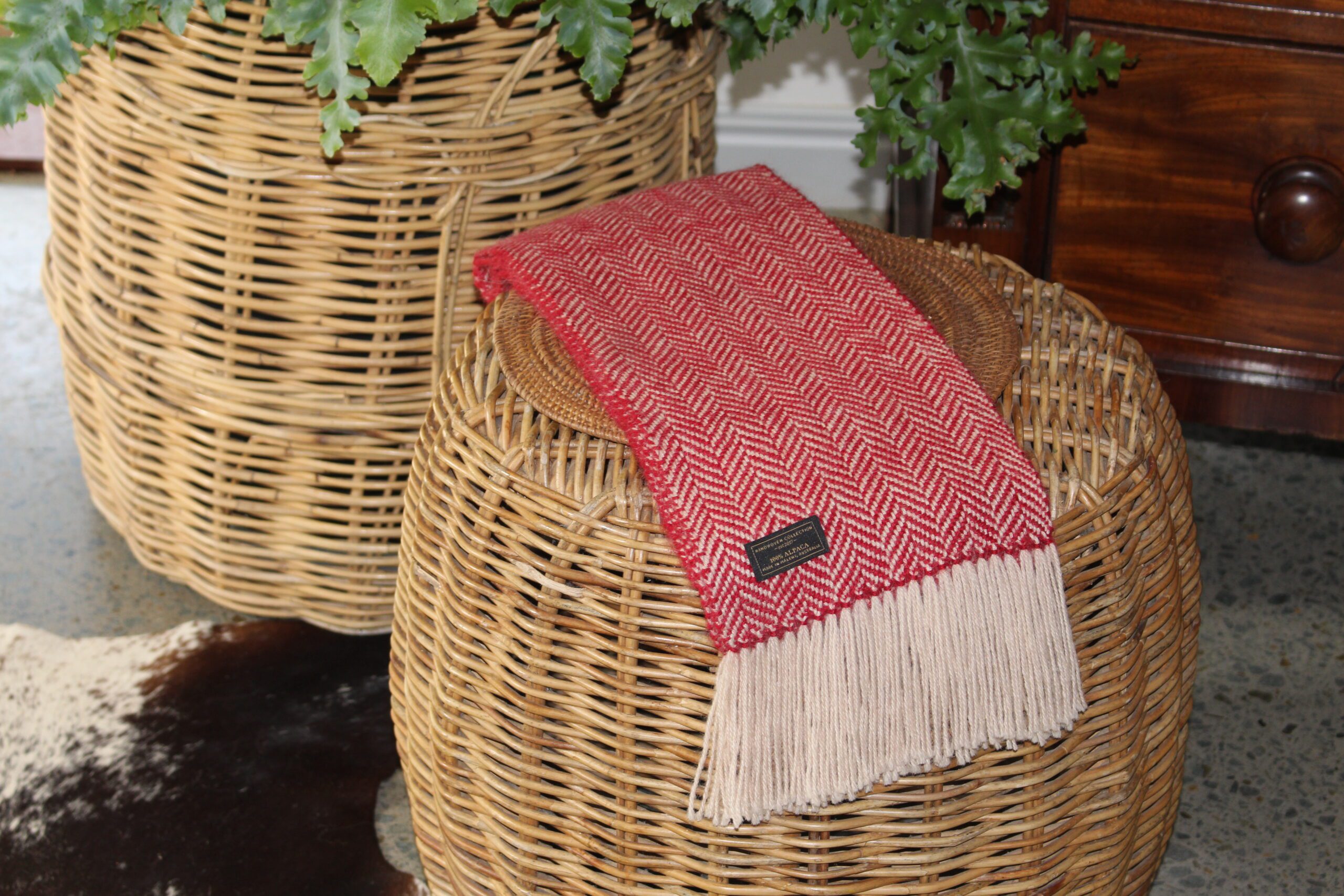 handwoven alpaca herringbone scarf on a seat