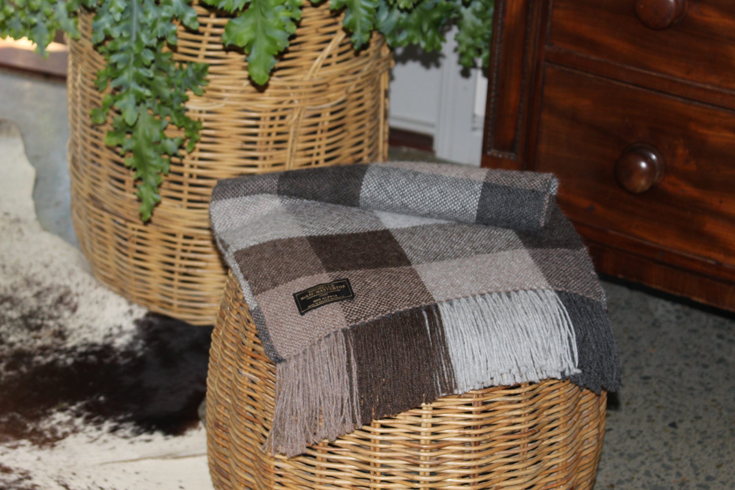 Handwoven Charcoal, Brown & Grey draped over seat